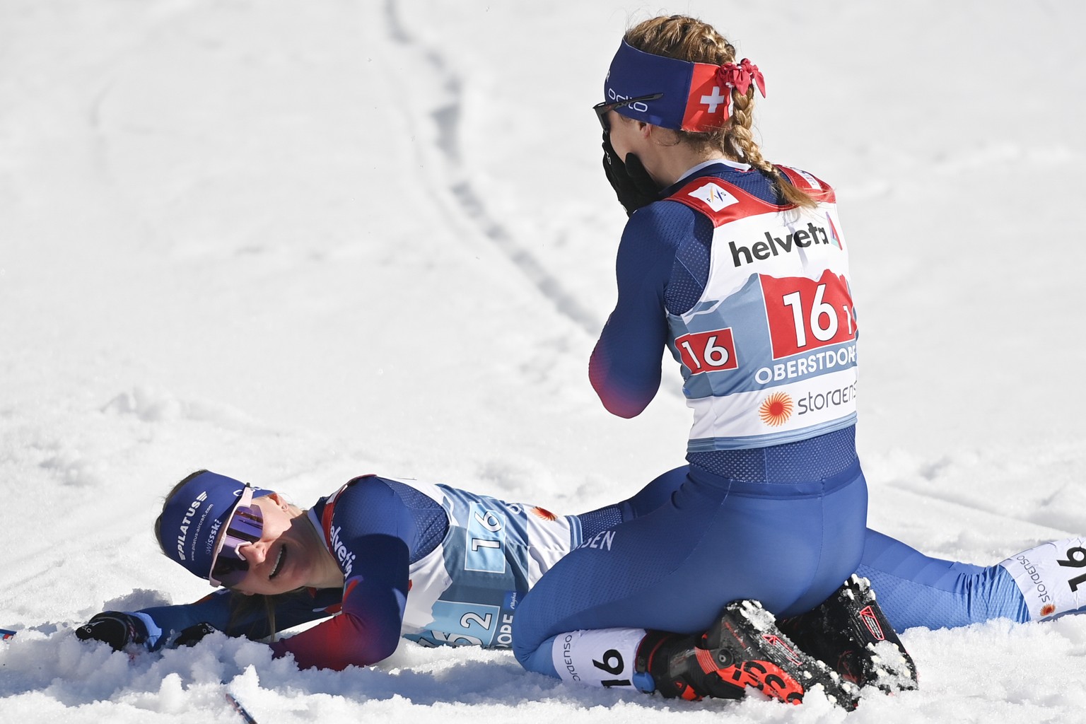 Nadine Faehndrich of Switzerland, left, and Laurien van der Graaff celebrate after the team sprint semi finals at the 2021 Nordic Skiing World Championships, in Oberstdorf, Germany, on Sunday, Februar ...