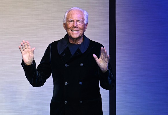 epa11838314 Italian designer Giorgio Armani greets the audience at the end of his Fall/Winter 2025/2026 collection presentation during Milan Fashion Week in Milan, Italy, 20 January 2025. The Fall/Win ...