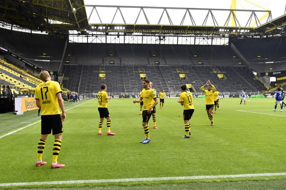 Dortmund&#039;s Erling Haaland, left, celebrates after scoring the opening goal during the German Bundesliga soccer match between Borussia Dortmund and Schalke 04 in Dortmund, Germany, Saturday, May 1 ...