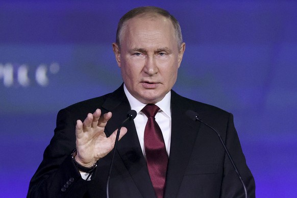 Russian President Vladimir Putin gestures as he addresses a plenary session of the St. Petersburg International Economic Forum in St.Petersburg, Russia, Friday, June 17, 2022. Putin began his address  ...