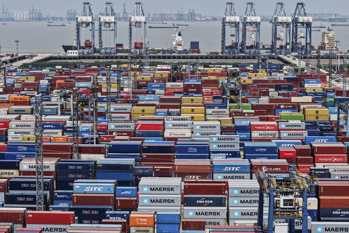 Containers are pile up at a container terminal in Shanghai, China, Sunday, April 20, 2025. (Chinatopix Via AP)
China Trump Tariffs