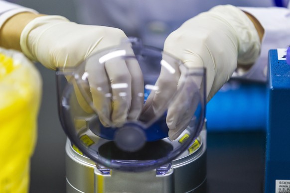 epa07190756 A technician works at the DNA research laboratory for gene sequencing in Nanjing, Jiangsu Province, China, 13 November 2018 (issued 26 November 2018). The National Health Medical Data Cent ...