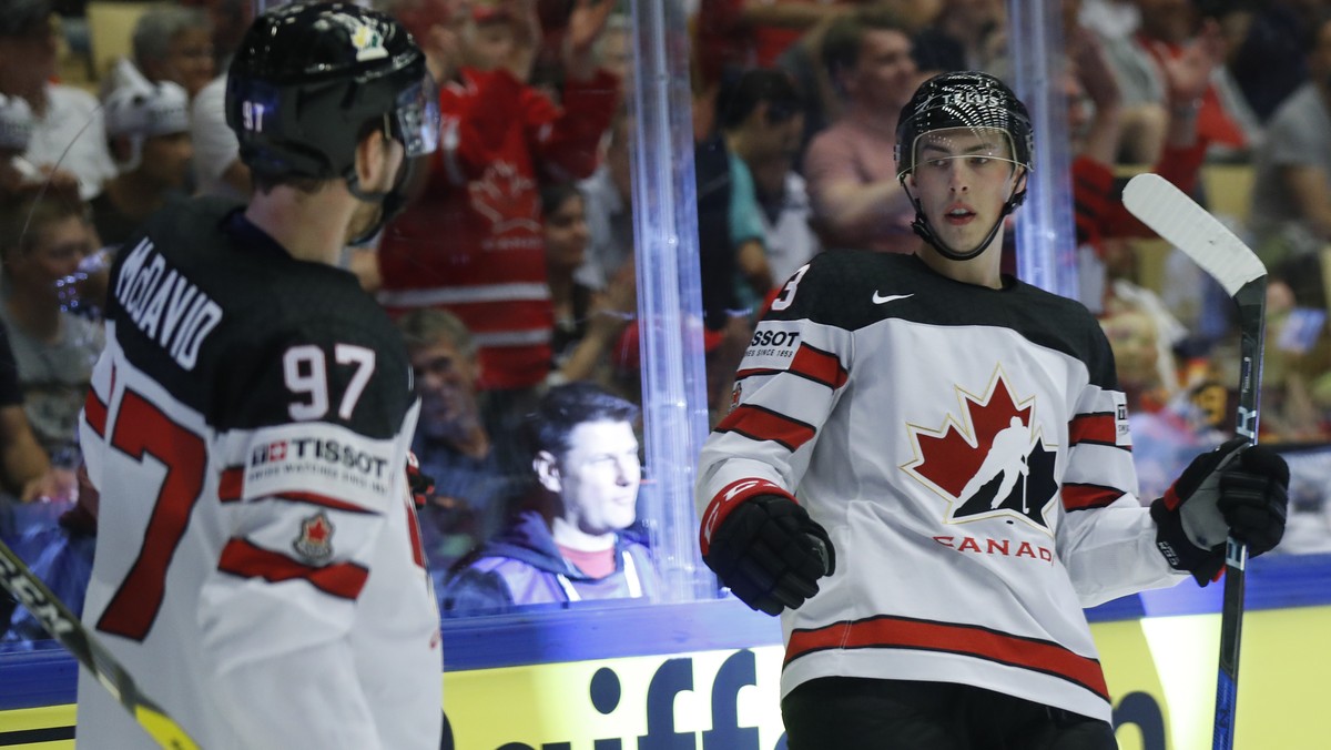 Canada's Ryan Nugent-Hopkins, right, celebrates with Connor McDavid, left, after scoring his sides second goal during the Ice Hockey World Championships group B match between Canada and Germany a ...