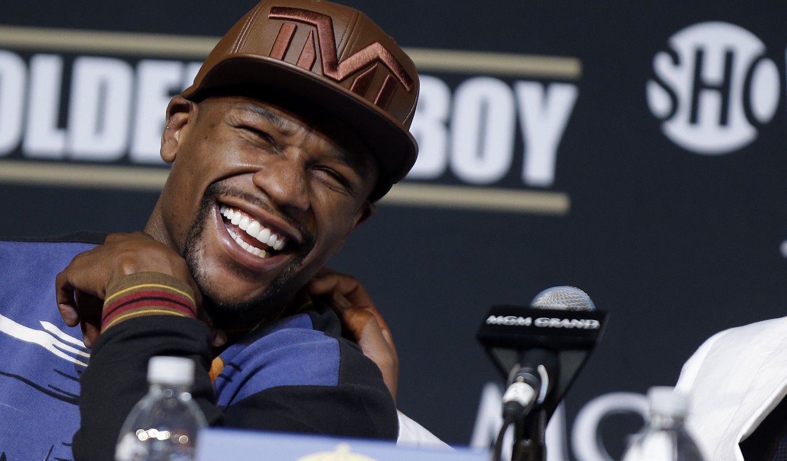 Boxer Floyd Mayweather Jr., left, and Mayweather Promotions CEO Leonard Ellerbe, laugh during a news conference Wednesday, April 30, 2014, in Las Vegas. Mayweather will face Marcos Maidana in a welter ...