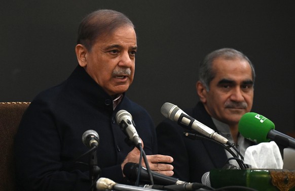 epa11150099 Pakistan&#039;s former prime minister and leader of the Pakistan Muslim League-Nawaz (PML-N) party Shehbaz Sharif (L) speaks during a press conference in Lahore, Pakistan, 13 Feburay 2024. ...