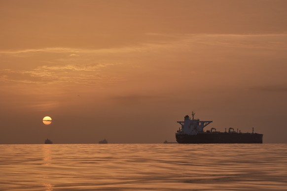 The sun rises behind tankers anchored in the Strait of Hormuz off the coast of Qeshm Island, Iran, Saturday, April 18, 2026. (AP Photo/Asghar Besharati)
APTOPIX Iran War