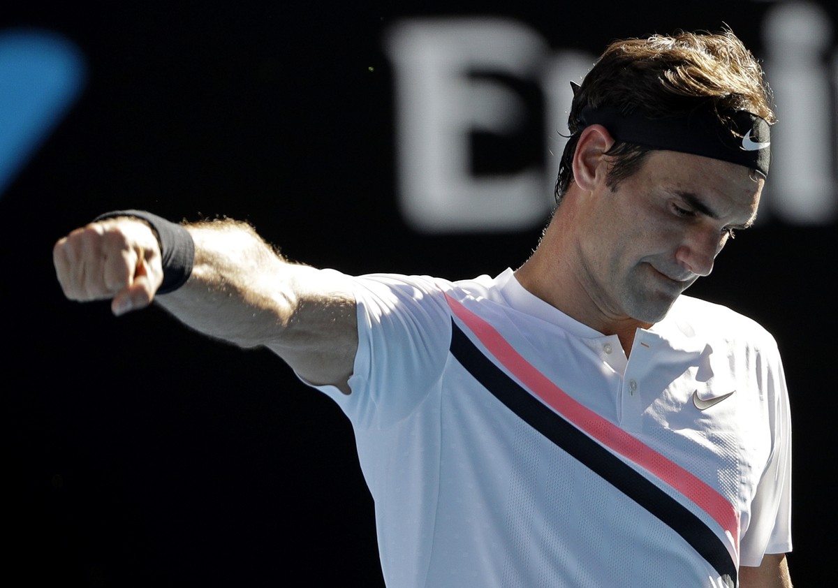 Switzerland's Roger Federer celebrates after defeating Hungary's Marton Fucsovics in their fourth round match at the Australian Open tennis championships in Melbourne, Australia, Monday, Jan ...