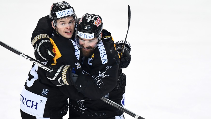 LuganoÕs player Gregory Hofmann, left, and LuganoÕs player Julien Vauclair, right, celebrate the 3-2 goal during the fifth match of the quarterfinal of National League Swiss Championship 2017/18 betwe ...