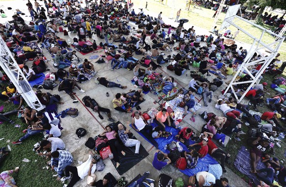 A caravan of migrants, mostly from Central America, heading north, stop to rest in the Alvaro Obregon community, Tapachula municipality, Chiapas state, Mexico, Saturday, Oct. 23, 2021. (AP Photo/Marco ...