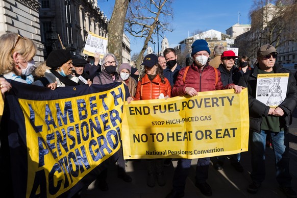 epa09735786 Members of the National Pensioners Convention and their supporters stage a protest against the rise in fuel and energy prices outside Downing Street in Westminster, London, Britain, 07 Feb ...