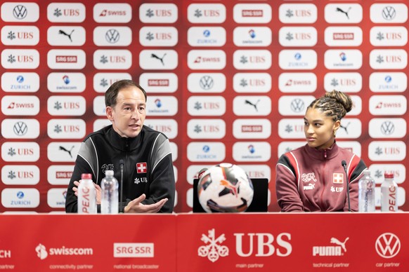 CORRECTS NAME - Switzerland's head coach Rafael Navarro, left, speaks next to Switzerland's Sydney Schertenleib, right, during a news conference the day before the World Cup qualifier soccer ...
