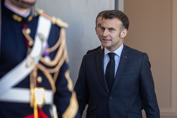 epa12776132 French President Emmanuel Macron looks on as Felix Tshisekedi (not pictured), President of the Democratic Republic of Congo, arrives for a meeting at the Elysee Palace in Paris, France, 25 ...