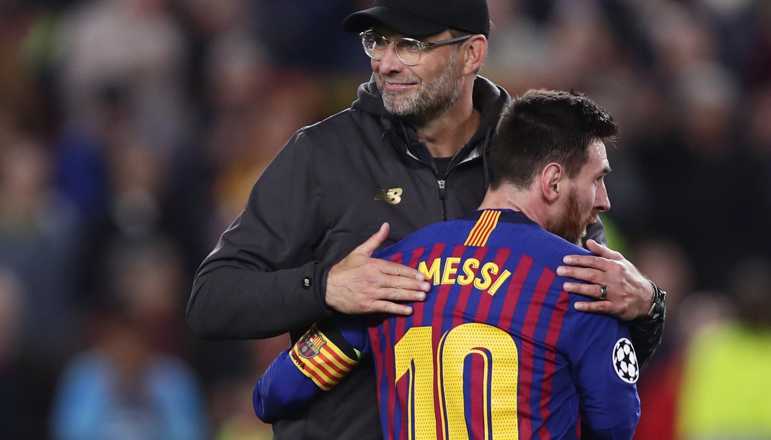 Barcelona&#039;s Lionel Messi, who scored two of the team&#039;s three goals, hugs Liverpool coach Juergen Klopp after the Champions League semifinal first leg soccer match between FC Barcelona and Li ...