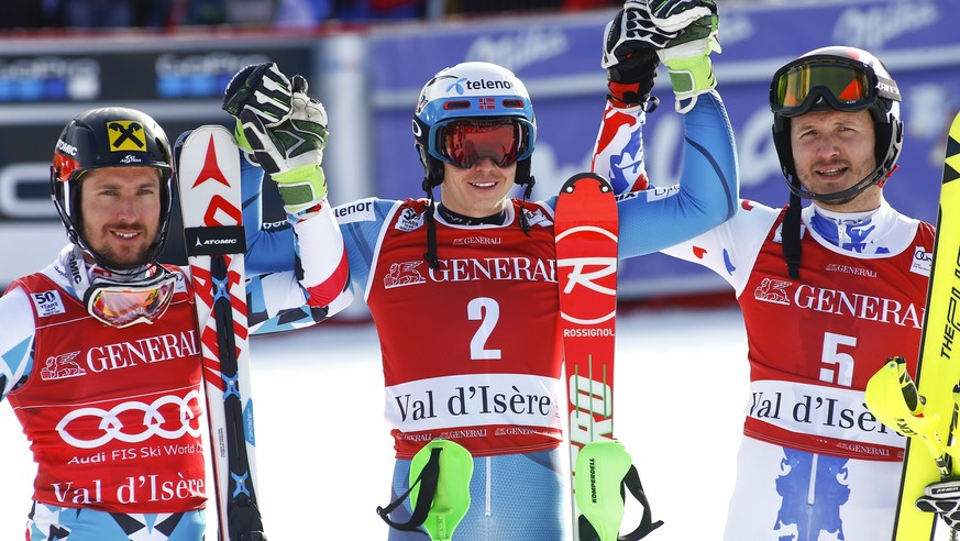 Norway&#039;s Henrik Kristoffersen, center,, celebrates with second placed Austria&#039;s Marcel Hirscher , left, and third placed Russia&#039;s Alexander Khoroshilov after winning an alpine ski, men& ...