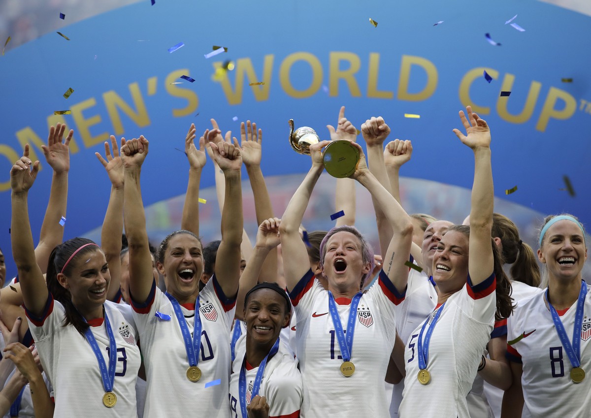 FILE - United States' Megan Rapinoe lifts up a trophy after winning the Women's World Cup final soccer match between U.S. and The Netherlands at the Stade de Lyon in Decines, outside Lyon, F ...