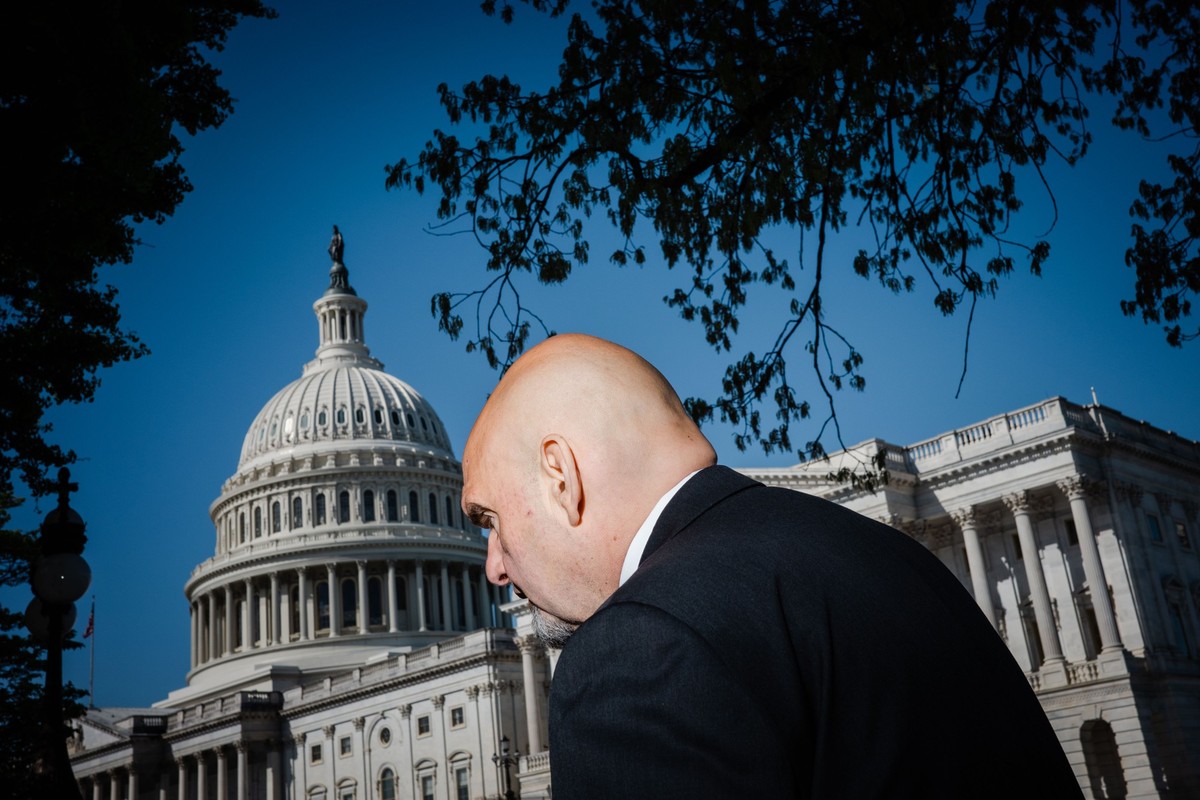 WASHINGTON, DC - APRIL 18: Sen. John Fetterman (D-PA) walks to a news conference on the "Ending Trading and Holdings in Congressional Stocks (ETHICS) Act" and efforts to ban members of Congr ...
