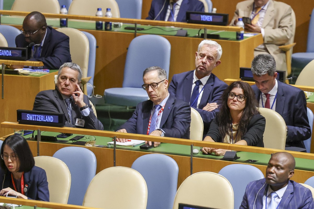 epa13256729 Vice President of Switzerland Ignazio Cassis (L) listens to President of the Swiss Confederation Guy Parmelin speak during the General Debate of the 81st session of the United Nations Gene ...