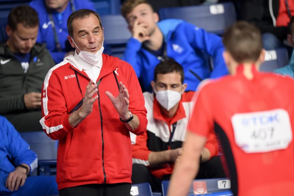 Karl Wyler, coach of Simon Ehammer, left, confers with Simon Ehammer of Switzerland, during the Men's Pole Vault of the Heptathlon, at the World Athletics Indoor Championships, at the Stark Arena ...
