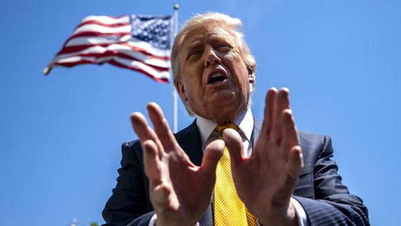 epa12951612 US President Donald Trump speaks to the press before departing the White House for China, in Washington, DC, USA, 12 May 2026. President Trump is leaving the US to visit China where he wil ...