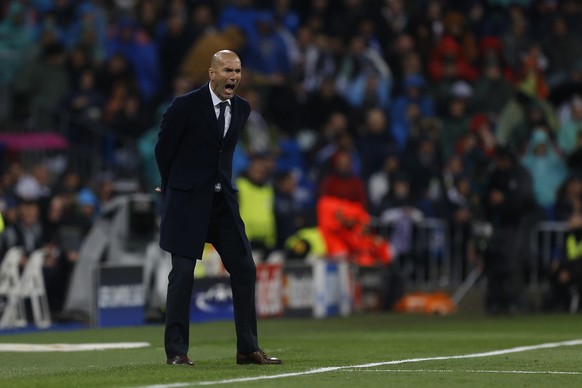 Real Madrid&#039;s head coach Zinedine Zidane reacts during the Champions League 2nd leg quarterfinal soccer match between Real Madrid and VfL Wolfsburg at the Santiago Bernabeu stadium in Madrid, Spa ...