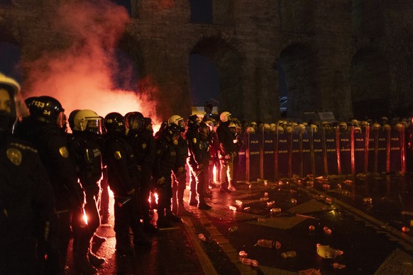 epa11979530 Turkish riot police block demonstrators trying to march to Taksim Square from the Istanbul Municipality headquarters during a protest against the detention of Istanbul Mayor Ekrem Imamoglu ...