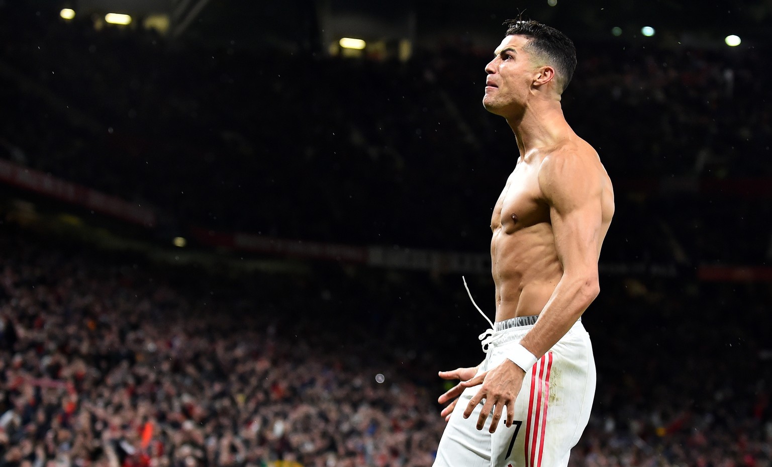 epa09496432 Cristiano Ronaldo of Manchester United celebrates after scoring during the UEFA Champions League group F soccer match between Manchester United and Villarreal CF in Manchester, Britain, 29 ...