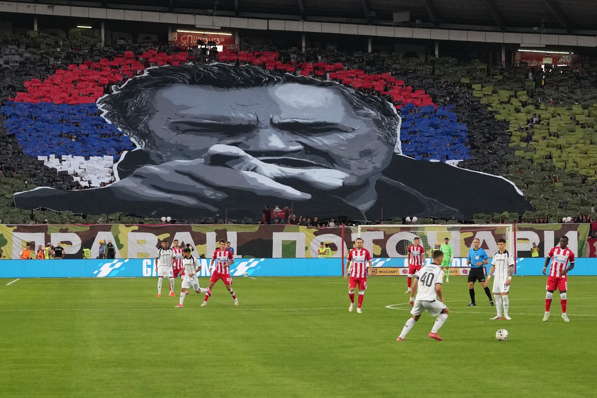 Red Star fans form an image of former Bosnian Serb wartime general Ratko Mladic during a Serbian National soccer league derby match between Red Star and Partizan in Belgrade, Serbia, Sunday, Sept. 6,  ...