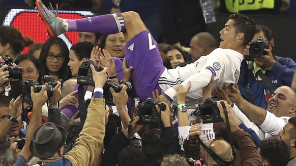 Real Madrid&#039;s Cristiano Ronaldo is thrown in the air after the Champions League final soccer match between Juventus and Real Madrid at the Millennium Stadium in Cardiff, Wales, Saturday June 3, 2 ...