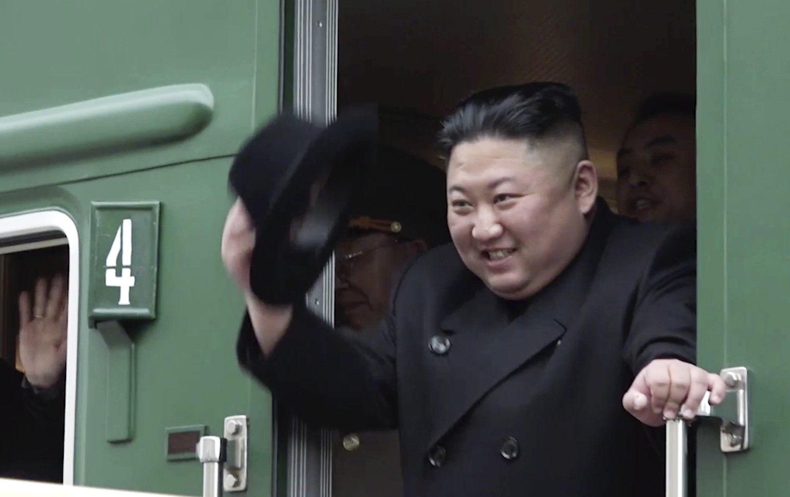 FILE - In this image from a video released by the press office of the Primorsky Regional Government, North Korean leader Kim Jong Un waves from his train as he leaves the Khasan train station in the Primorye region, ...