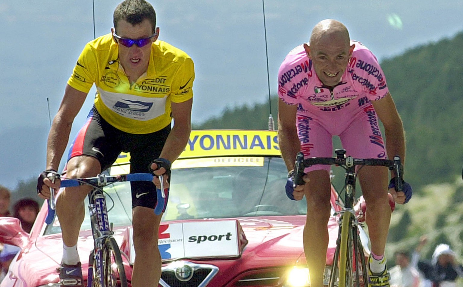 Marco Pantani of Italy, right, sprints to beat overall leader Lance Armstrong of Austin, Texas, and win the 12th stage of the Tour de France cycling race between Carpentras and Mont Ventoux, southern  ...