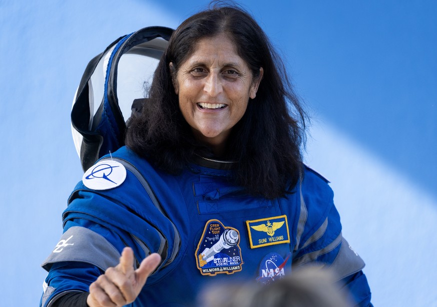 epa11383616 Member of the NASA Boeing Crew Flight Suni Williams walks out of the Neil A. Armstrong Operations and Checkout Building to the Space Launch Complex-41 in Titusville, Florida, USA, 01 June  ...