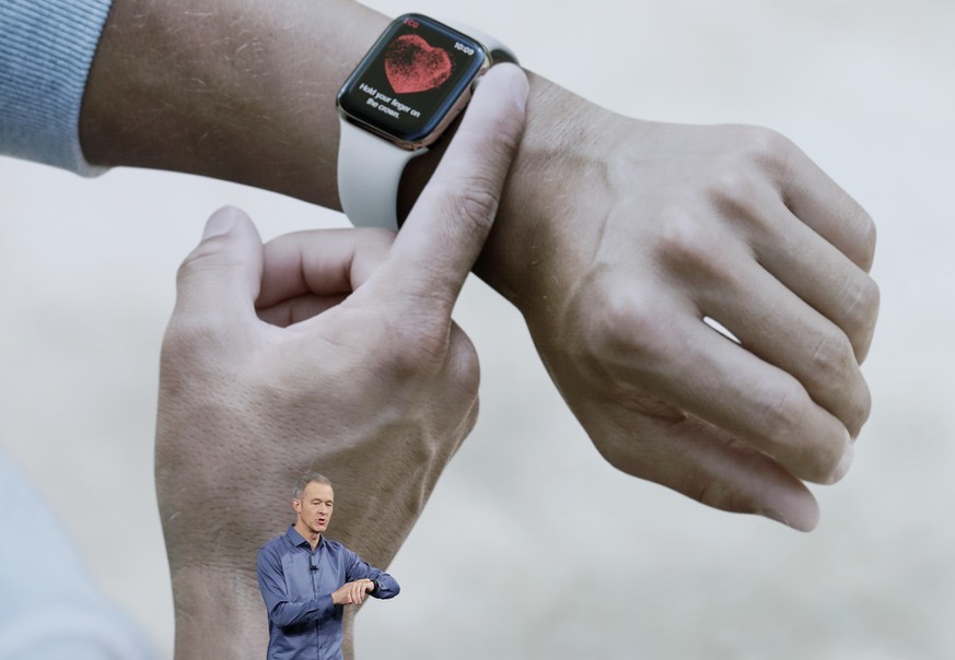 Jeff Williams, Apple's chief operating officer, speaks about the Apple Watch Series 4 at the Steve Jobs Theater during an event to announce new Apple products Wednesday, Sept. 12, 2018, in Cupertino,  ...
