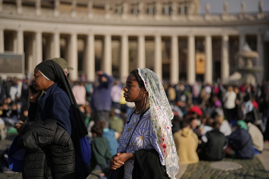 People wait for the funeral of Pope Francis in St. Peter&#039;s Square at the Vatican, Saturday, April 26, 2025. (AP Photo/Andreea Alexandru)
Vatican Pope
