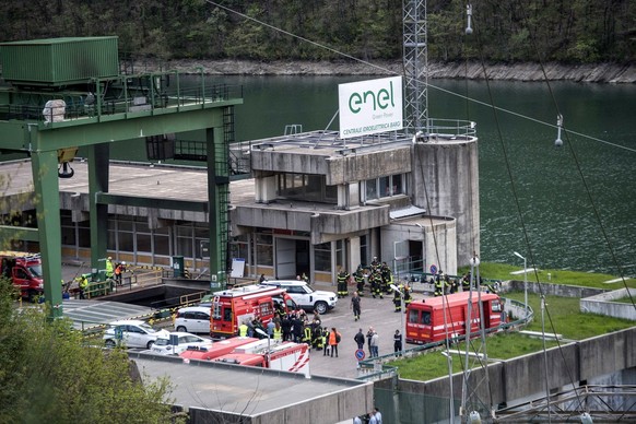 epa11268277 Rescuers work at the scene of an explosion that occurred in a hydroelectric power plant on the Lake Suviana reservoir, near Bologna, northern Italy, 09 April 2024. Four people were confirm ...