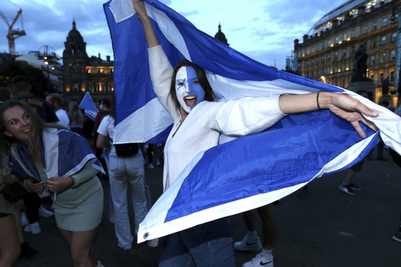 Scotland fans celebrate the Euro 2020 soccer championship group D match between England and Scotland, held at London&#039;s Wembley stadium, in Glasgow, Scotland, Friday, June 18, 2021. (Robert Perry/ ...