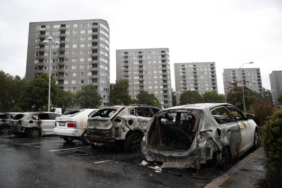 epa06948668 Burned out cars at Frolunda Square in Gothenburg, Sweden, 14 August 2018. According to reports, dozens of cars had been set on fire or damaged in Gothenburg and surrounding towns the previ ...