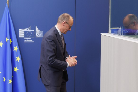 epa12572597 German Chancellor Friedrich Merz is welcomed by the European Commission President at the EU Commission in Brussels, Belgium, 05 December 2025. The German Chancellor and European Commission ...