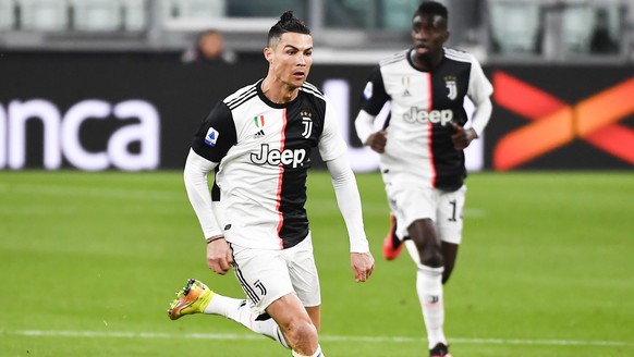 Juventus' Cristiano Ronaldo controls the ball during the Serie A soccer match between Inter Milan and Juventus at the Allianz Stadium in Turin, Italy, Sunday March 8, 2020. The match was played to a closed stadium as a measure against coronavirus contagion. (Marco Alpozzi/LaPresse via AP)