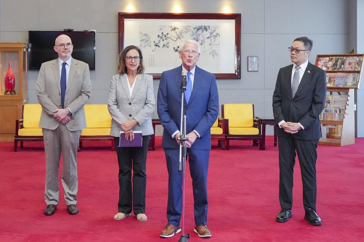 In this photo released by the Taiwan Ministry of Foreign Affairs, U.S. Senators Roger Wicker (Mississippi), center and Deb Fischer (Nebraska), third from left, speak to the media upon their arrival at ...