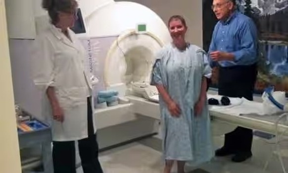 Kayt Sukel before entering the MRI scanner. On the right is orgasm researcher Barry Komisaruk. On the left is PhD student Nan Wise.