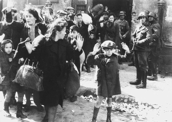 Warsaw Ghetto Boy (1943)

Likely taken by a Nazi photog named Franz Konrad, this photo shows Nazis rounding up Jewish people in the Warsaw ghetto. 

The 9-year-old boy in the picture may have been Dr. ...