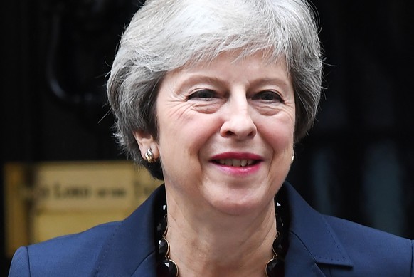 epa07099505 British Prime Minister Theresa May departs Downing Street for Prime Minister questions at parliament in London, Britain, 17 October 2018. May is set to meet EU leaders later today in Bruss ...