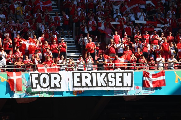 Denmark supporters display a banner for Christian Eriksen, the Danish player who collapsed during the match against Finland last Saturday, June 12, prior to the Euro 2020 soccer championship group B m ...