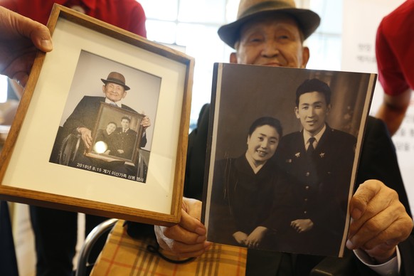 epa06957906 A South Korean separated family member holds a his family pictures to give his North Korean family at Hanwha resort on Sokcho in Gangwon-do, South Korea, 19 August 2018. Some 93 South Kore ...