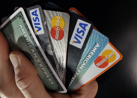 FILE - In this March 5, 2012 file photo, consumer credit cards are posed for a photo in North Andover, Mass. The Federal Reserve releases consumer credit data for March 2014 on Wednesday, May 7, 2014. ...
