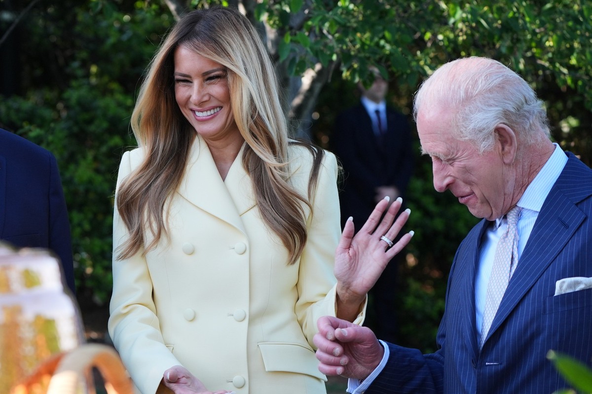 First lady Melania Trump and Britain's King Charles III talk during a tour of the White House garden and bee hive on the South Lawn of the White House, Monday, April 27, 2026, in Washington. (AP ...