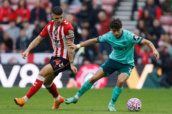 Sunderland&#039;s Granit Xhaka, left, and Wolverhampton Wanderers&#039; Hugo Bueno in action during the English Premier League soccer match between Crystal Palace and Bournemouth in London, Saturday O ...