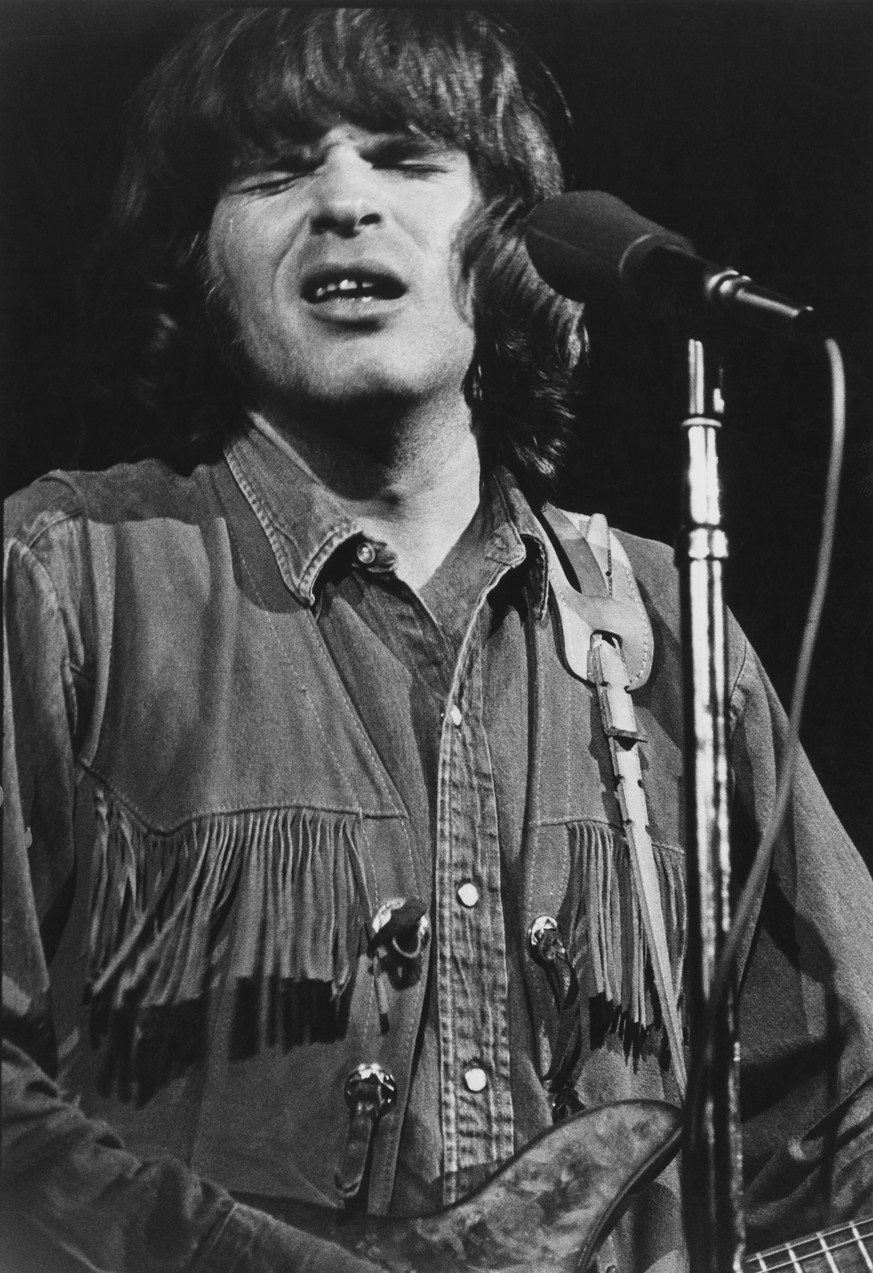 Singer songwriter and guitarist John Fogerty performing with American rock group Creedence Clearwater Revival at the Woodstock Music Festival, Bethel, New York, 17th August 1969. (Photo by Tucker Rans ...