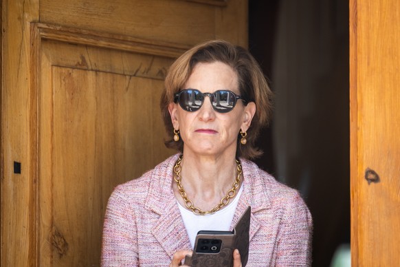 epa11464906 US journalist Anne Applebaum, the wife of Polish Foreign Minister Radoslaw Sikorski, wait for the arrival of British Foreign Secretary Lammy prior to a meeting in Chobielin, Poland, 07 Jul ...