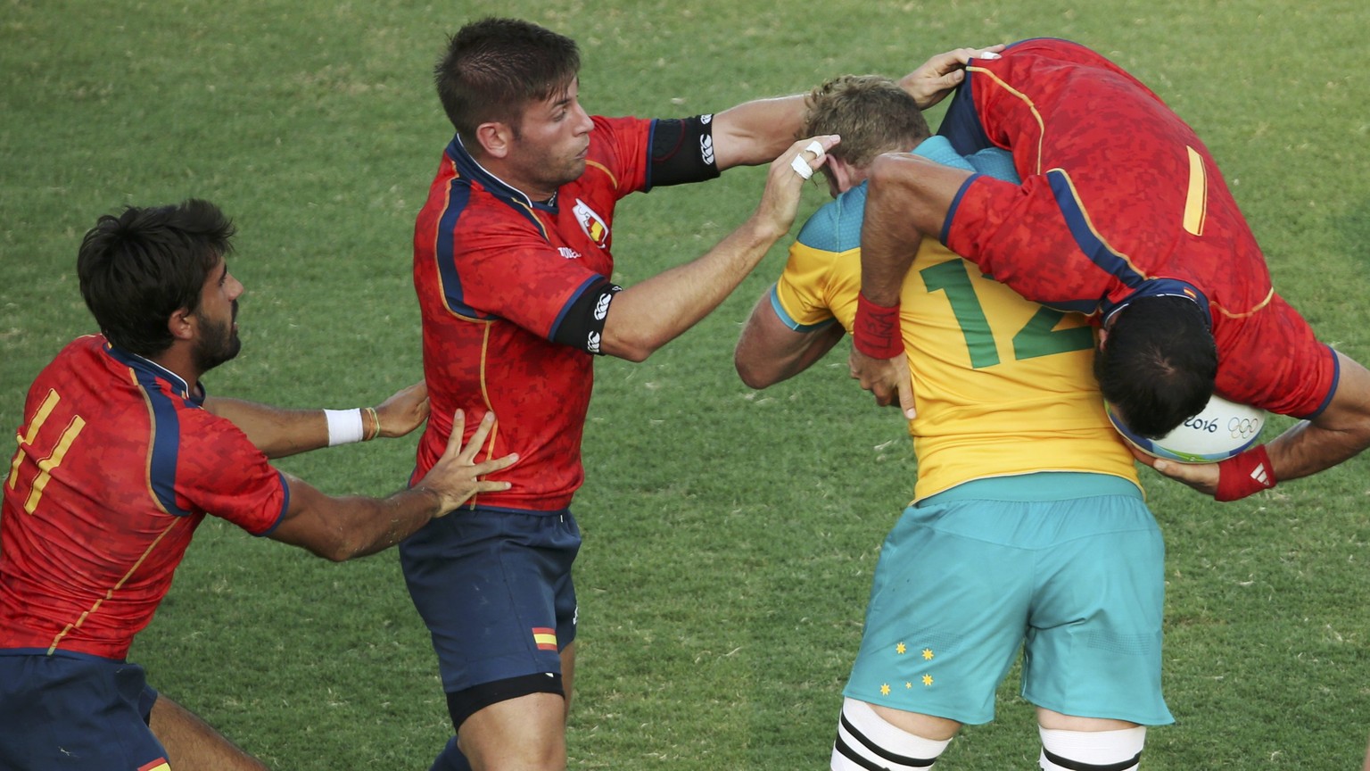 2016 Rio Olympics - Rugby - Preliminary - Men&#039;s Pool B Australia v Spain - Deodoro Stadium - Rio de Janeiro, Brazil - 09/08/2016. Tom Cusack (AUS) of Australia tackles Ignacio Martin (ESP) of Spa ...